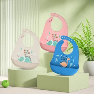 Babero de silicona con bolsillo – Dinos / Azul